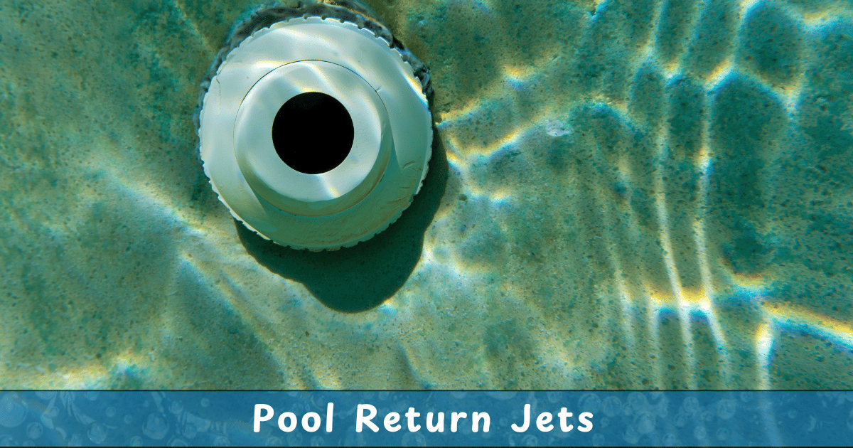 A close-up underwater view of a pool return jet, a circular white nozzle embedded in the pool wall, with rippling sunlight patterns reflecting on the pool floor.